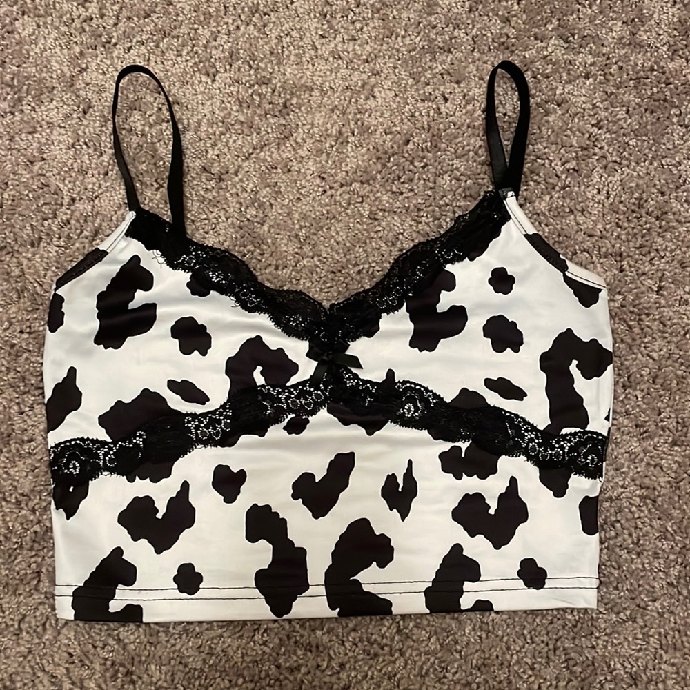 Cowprint top!Style with a white cowboy hat and some black/white cowboy boots:)